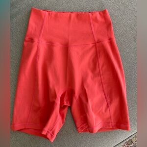 Dark salmon bike cut workout shorts